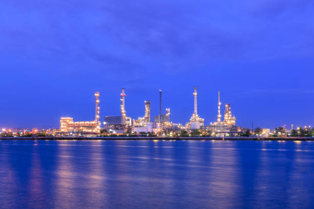 istock Oil refinery on water front at twilight 1128853820