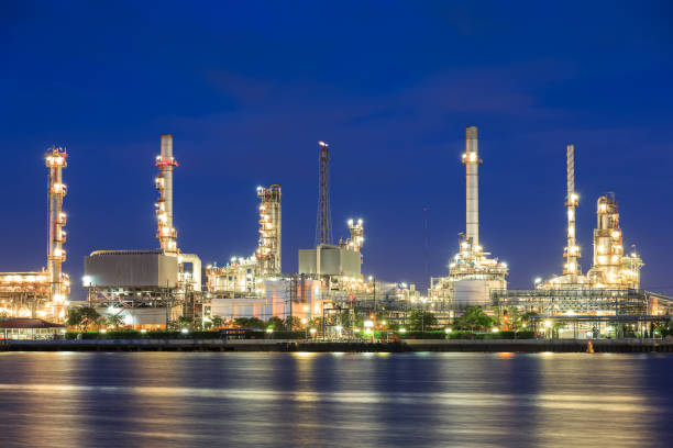 istock Oil refinery on water front at twilight 1128853829
