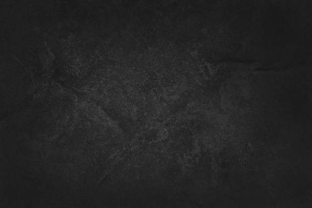 istock Dark grey black slate texture with high resolution, background of natural black stone wall. 1128856546