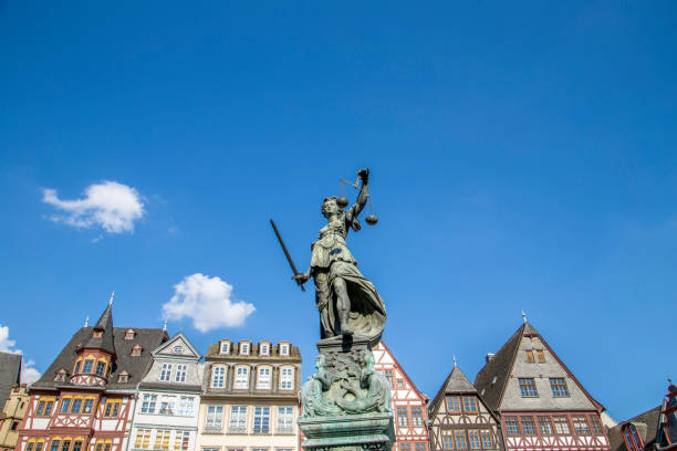 istock Justitia (Lady Justice) sculpture on the Roemerberg square in Frankfurt 1128857969