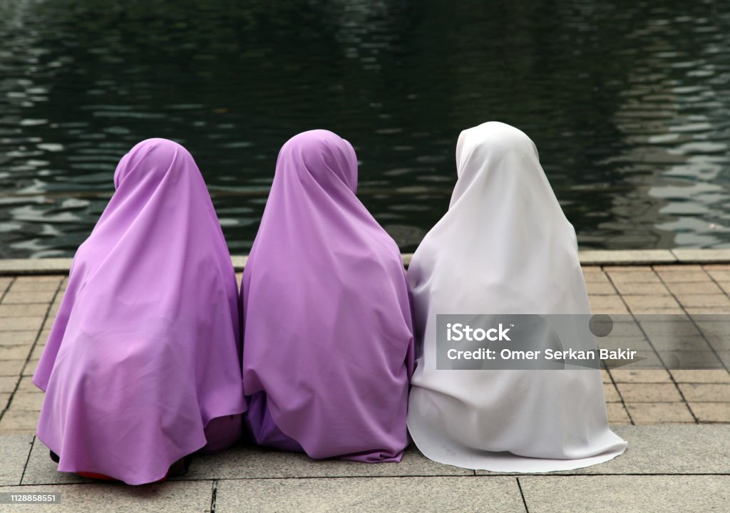 Girls with headscarves Girls in purple and white headscarf. Child Stock Photo