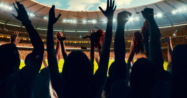 istock Fans cheering for sports team 1128858891