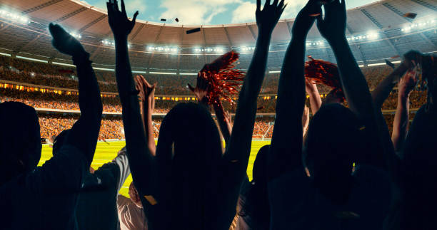 istock Fans cheering for sports team 1128858894
