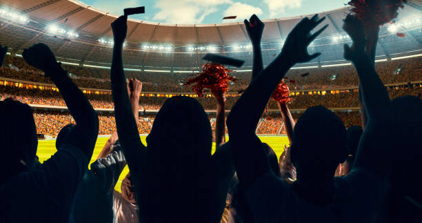 istock Fans cheering for sports team 1128858898