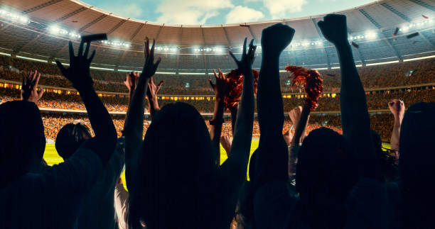 istock Fans cheering for sports team 1128858899