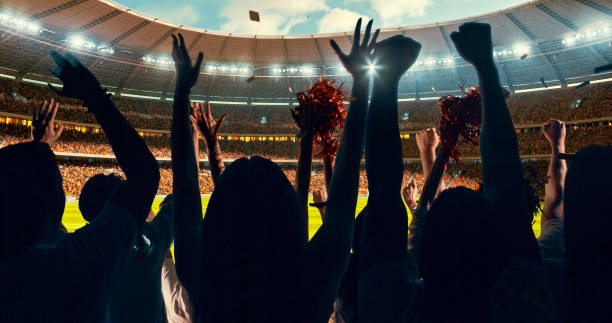 istock Fans cheering for sports team 1128858900