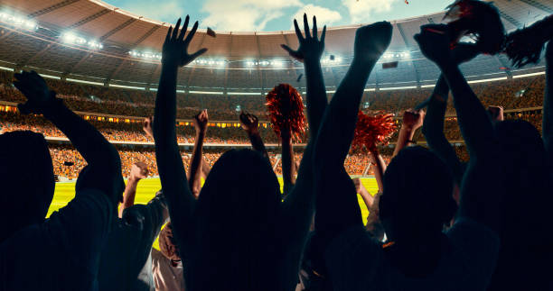 istock Fans cheering for sports team 1128858901