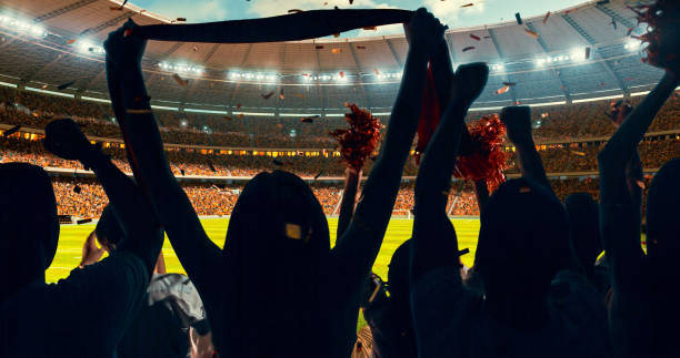 istock Fans cheering for sports team 1128858903