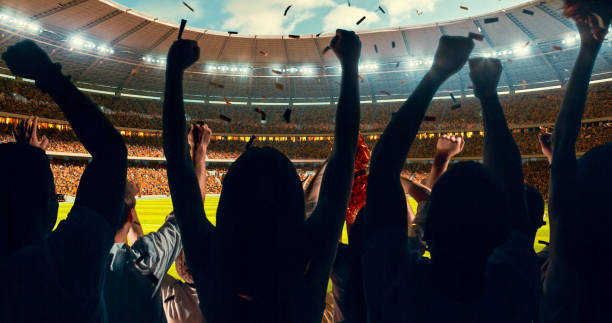 istock Fans cheering for sports team 1128858909