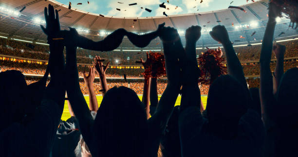 istock Fans cheering for sports team 1128858912