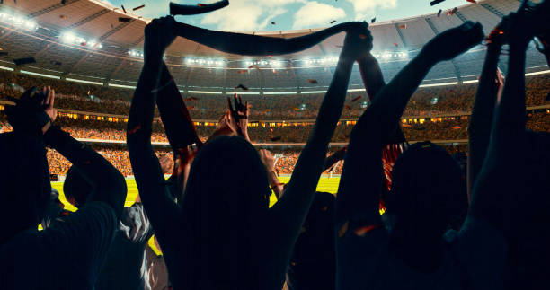 istock Fans cheering for sports team 1128858913