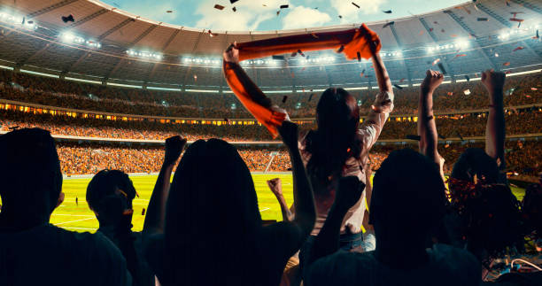 istock Fans cheering for sports team 1128858915