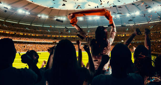 istock Fans cheering for sports team 1128858916