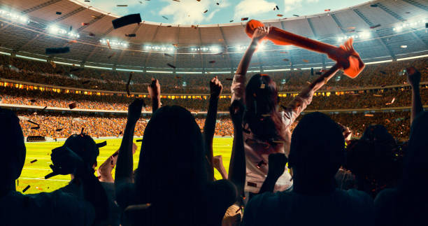 istock Fans cheering for sports team 1128858918