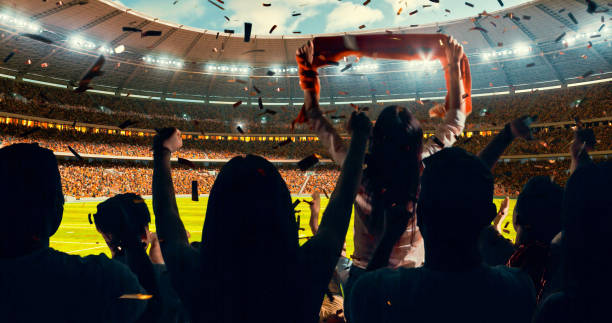 istock Fans cheering for sports team 1128858924