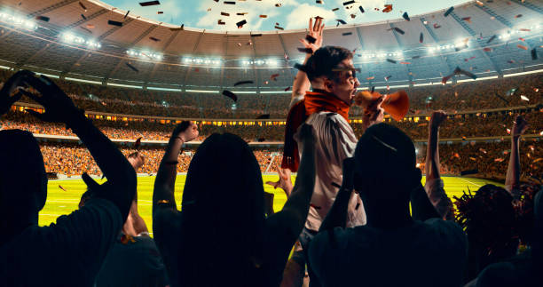istock Fans cheering for sports team 1128858927