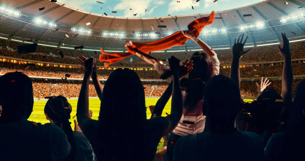 istock Fans cheering for sports team 1128858929