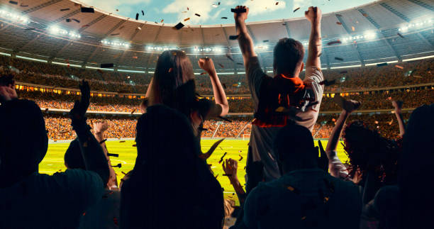 istock Fans cheering for sports team 1128858938