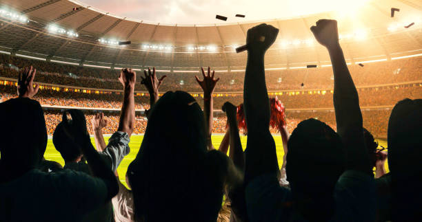 istock Fans cheering for sports team 1128858939