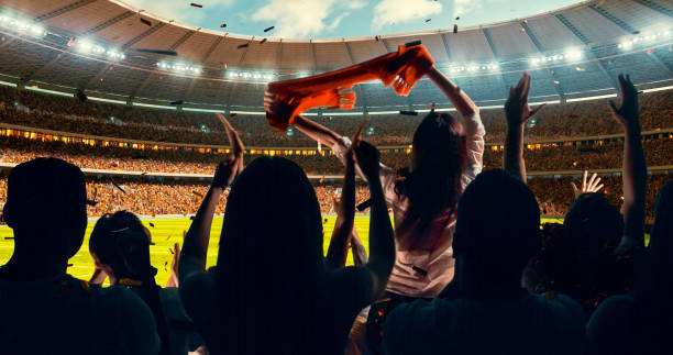 istock Fans cheering for sports team 1128858940
