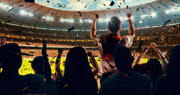 istock Fans cheering for sports team 1128858941