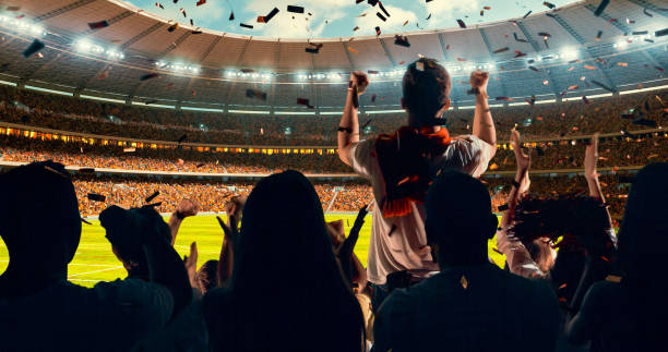 istock Fans cheering for sports team 1128858945