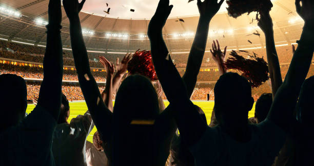 istock Fans cheering for sports team 1128858952