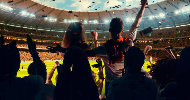 istock Fans cheering for sports team 1128858957