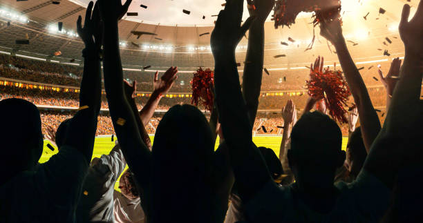 istock Fans cheering for sports team 1128858958