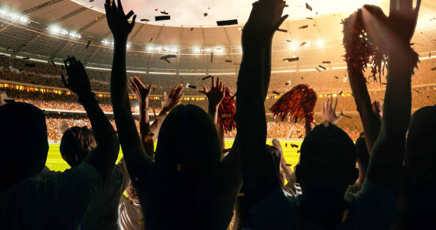 istock Fans cheering for sports team 1128858960