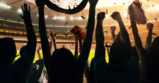 istock Fans cheering for sports team 1128858965