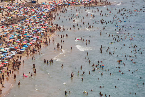 istock Mediterranean coastline in Spain. Calpe beach. Summer crowd. Alicante 1128859281