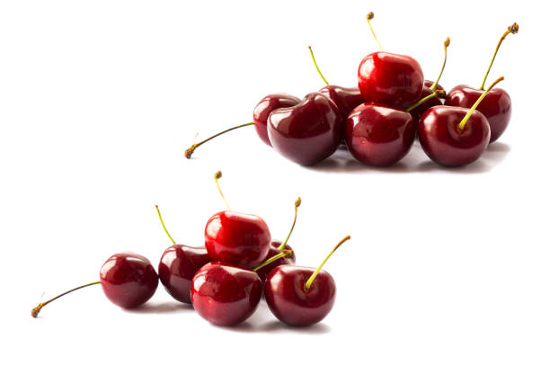 istock Fresh red cherries isolated on white background. Cherry fruit with copy space for text. Ripe cherry on a white background. 1128859947