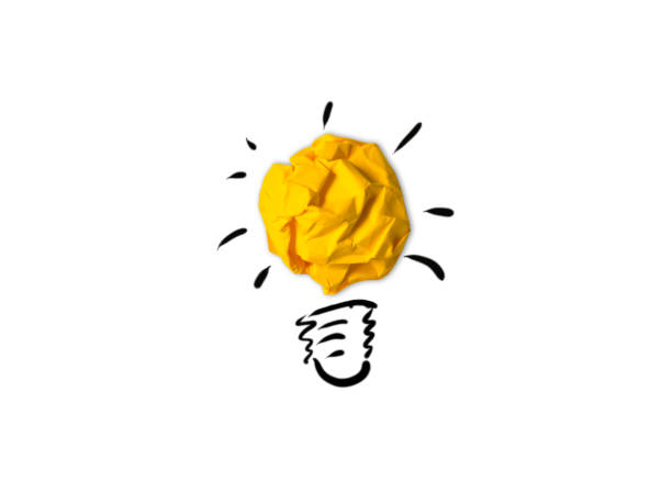 Idea light bulb success inspiration crumpled paper isolated background
