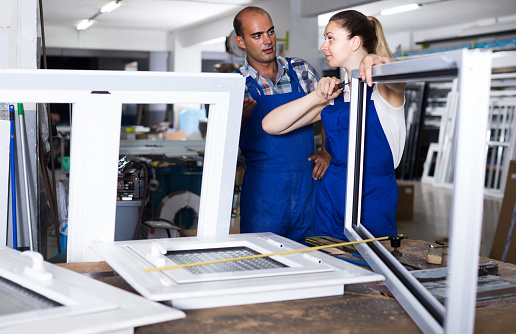Window Assembly Process Foreman Explaining Plastic Windows Assembly Process To Young Female ...