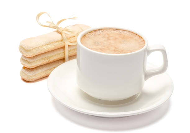 istock White ceramic cup of coffee with a savoiardi ladyfinger cookie on a plate 1128865708