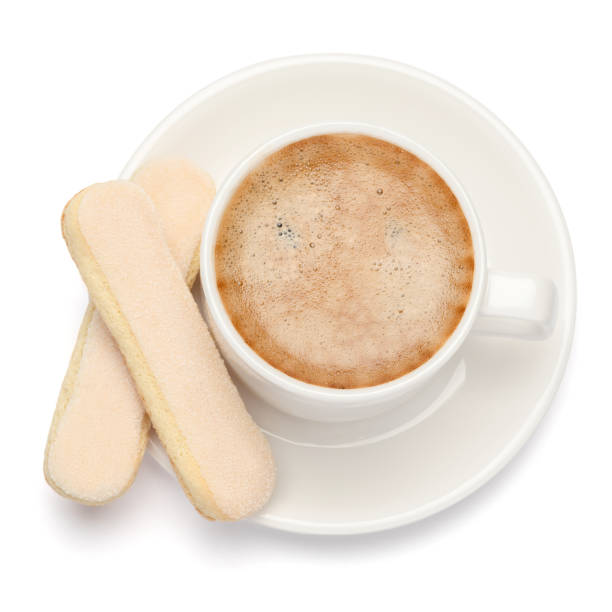 istock White ceramic cup of coffee with a savoiardi ladyfinger cookie on a plate 1128865710