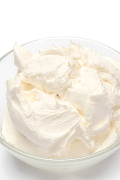 istock Traditional Mascarpone cheese in glass bowl isolated on white 1128865766