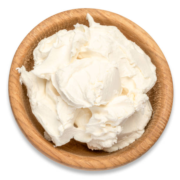 traditional mascarpone cheese in wooden bowl isolated with clipping path - cream cheese imagens e fotografias de stock