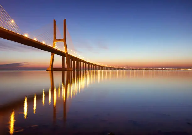 Photo of Lisbon bridge - Vasco da Gama at sunrise, Portugal