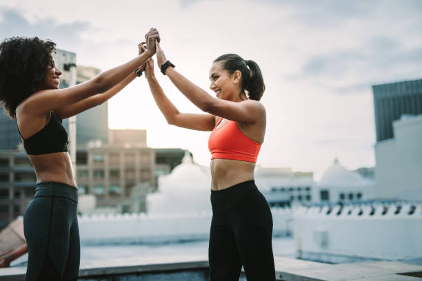 istock Fitness women celebrating after workout 1128867792