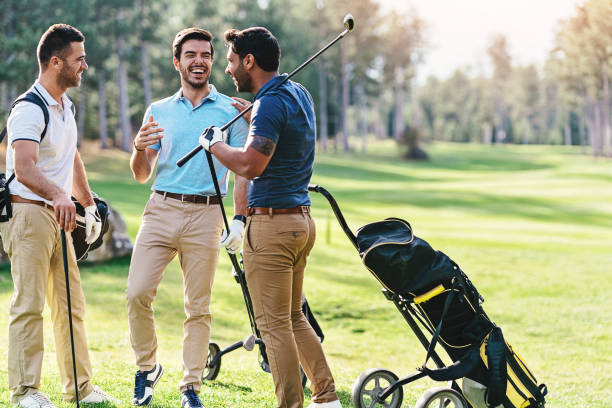 istock Group of golf players talking and laughing 1128870500
