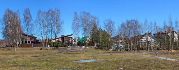 istock Lithuanian no name village spring panoramic landscape 1128870700