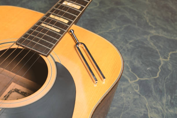 istock Acoustic guitar and diapason 1128871125