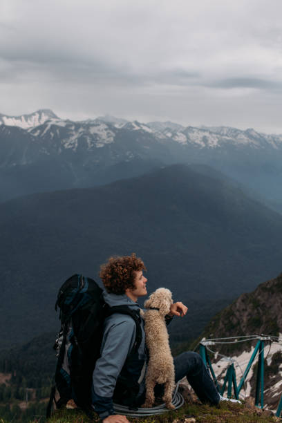 istock adventurous owner with pet enjoying the life 1128871173