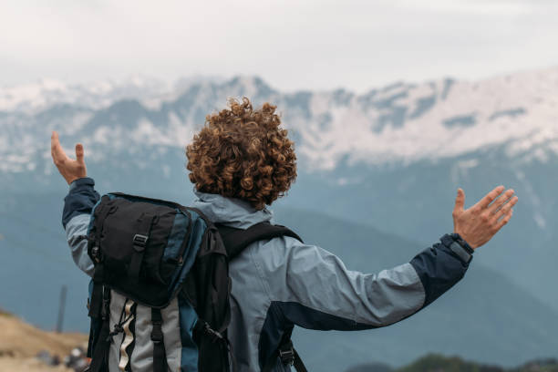 istock young ambitious man enjoying the mountaines majesty 1128871198