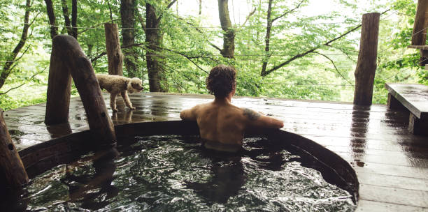 relaxed young holidaymaker is taking pleasure in bathing and wonderful scenery