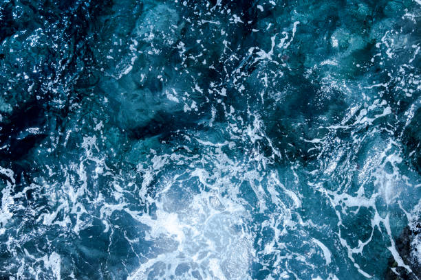 istock Blue deep sea foaming water background 1128871540