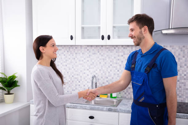 istock Serviceman Shaking Hands With Woman 1128872900