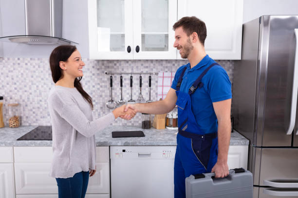 istock Serviceman Shaking Hands With Woman 1128872903